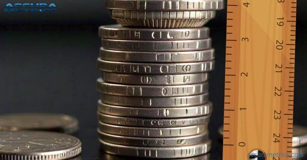 Four stacked quarters with a ruler indicating the measurement, showcasing their combined height of almost 4 inches.