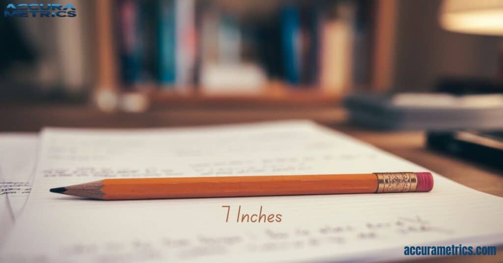 A 7-inch standard pencil next to handwritten notes on paper.