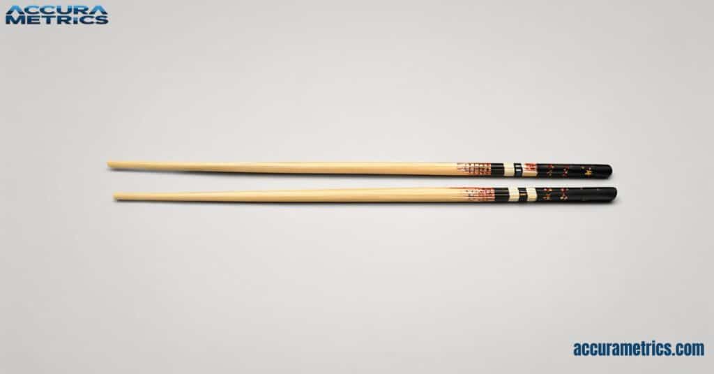 A pair of 15 Centimeters wooden chopsticks laid parallel