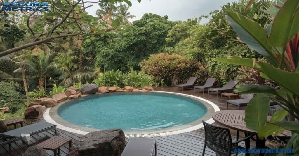 Circular and surrounded by tropical plants.