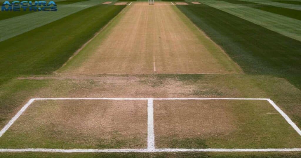 Close up of the cricket pitch at  Stadium, featuring the 22 yard pitch and marked creases.