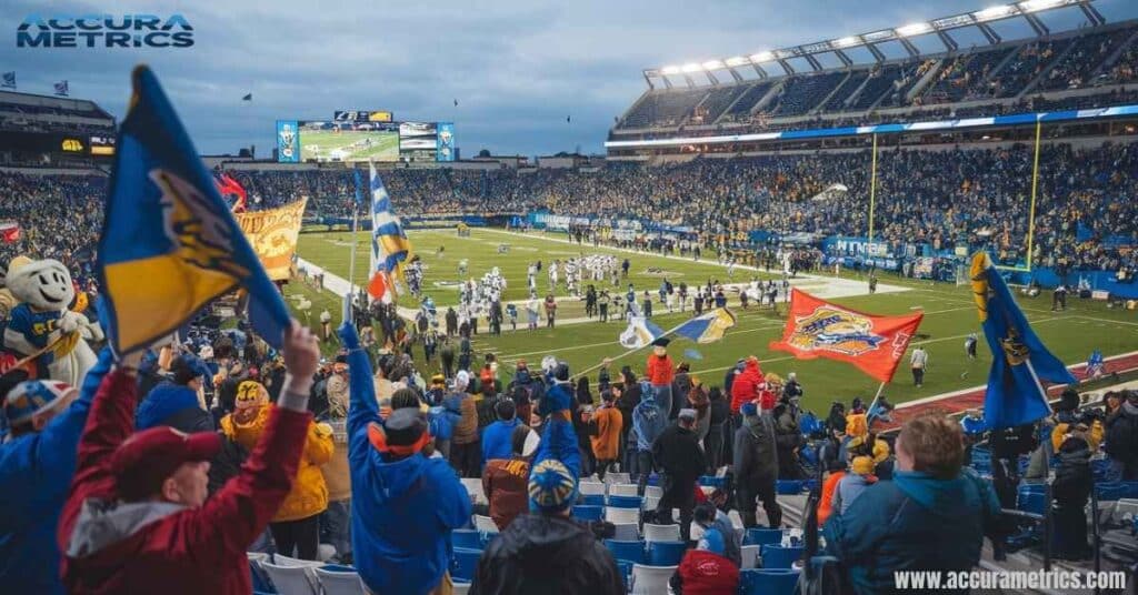 A football stadium with cheering fans and colorful banners.